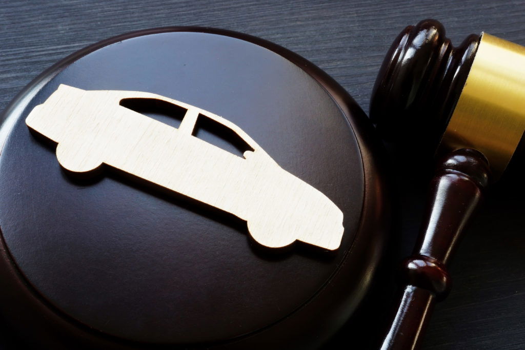 Model of car and gavel. Accident lawsuit or insurance, court case. Model of car and gavel. Accident lawsuit or insurance, court case.
