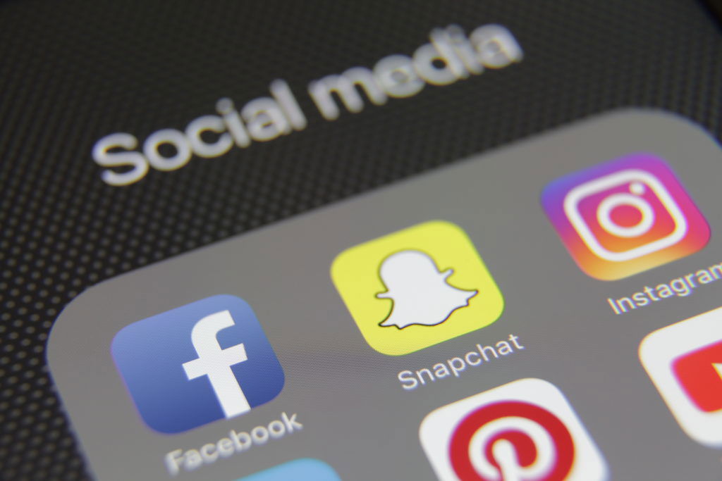 Social media icons internet app application Berlin, Germany - 05 28 2016: Apple iPhone 6s screen with social media applications Facebook, Instagram, Twitter, Google, Youtube, Snapchat, Vimeo, LinkedIn, Pinterest, WhatsApp etc.