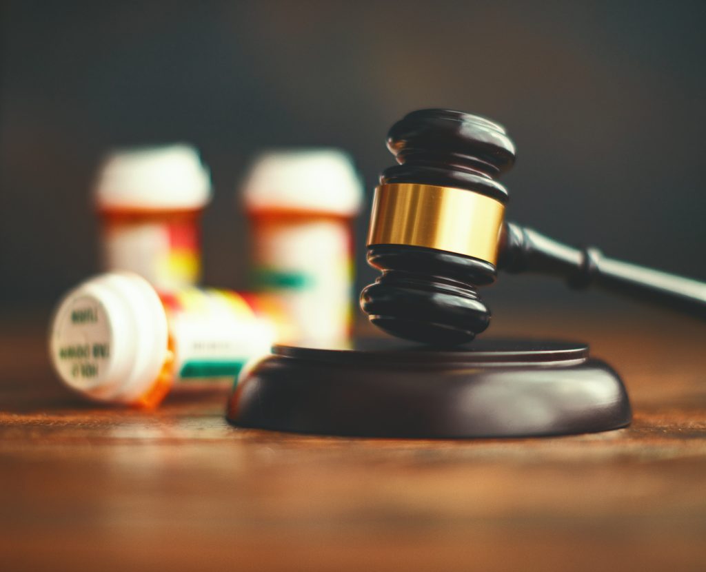 Judge's gavel with medications. Medical malpractice Judge's gavel with medications. Medical malpractice
